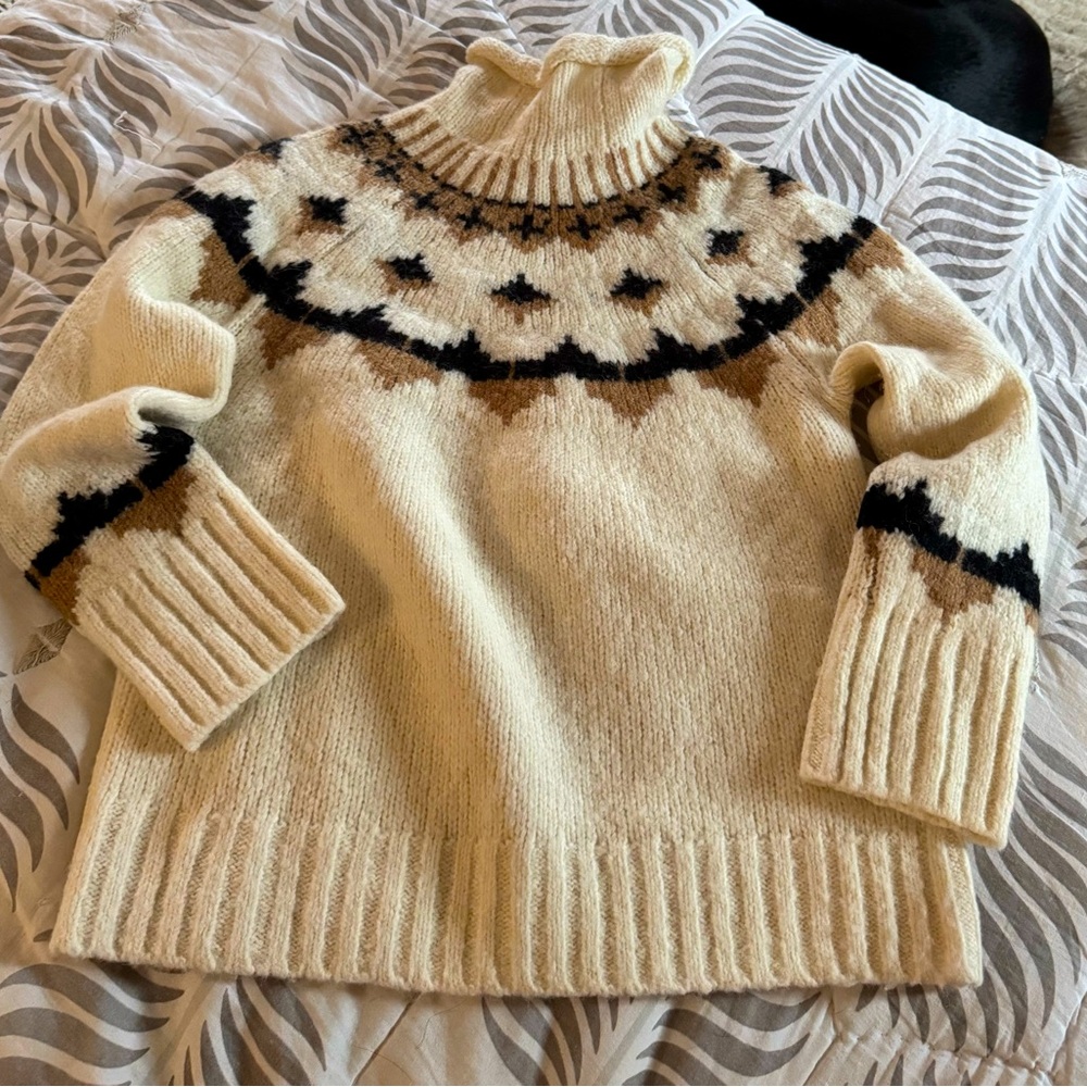 A.L.C. Amazing sweater . Great lines. Comfortable and warm.